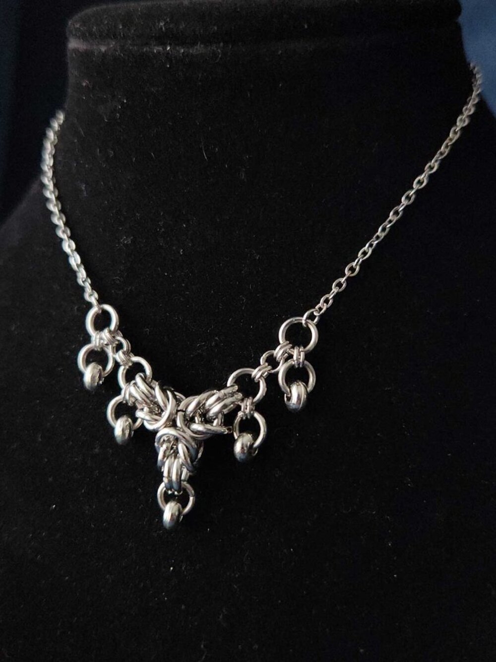 Gothic silver V shaped crown necklace with a small silver chain